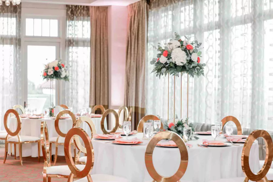 Classic Gold Oval Wedding Reception Chair Ideas | Tall Gold Flower Stand with White Hydrangeas, Pink Roses, and Greenery Fall Centerpiece Decor Ideas | Tampa Bay Event Venue The Birchwood