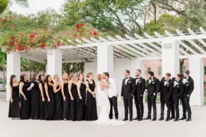 Mismatched Black Satin Floor Length Bridesmaids Dress Inspiration | White Lace Deep V Neckline Fit and Flare Wedding Dress Ideas | Black and White Tuxedos with Bow Ties | St Petersburg Photographer Eddy Almaguer Photography
