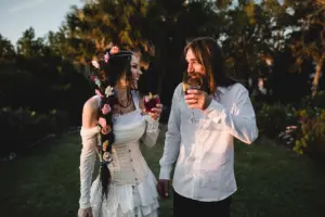 Hippy Sunset Wedding Reception Inspiration | Flowers in Boho Long Hair Braid Ideas | Corset Wedding Dress