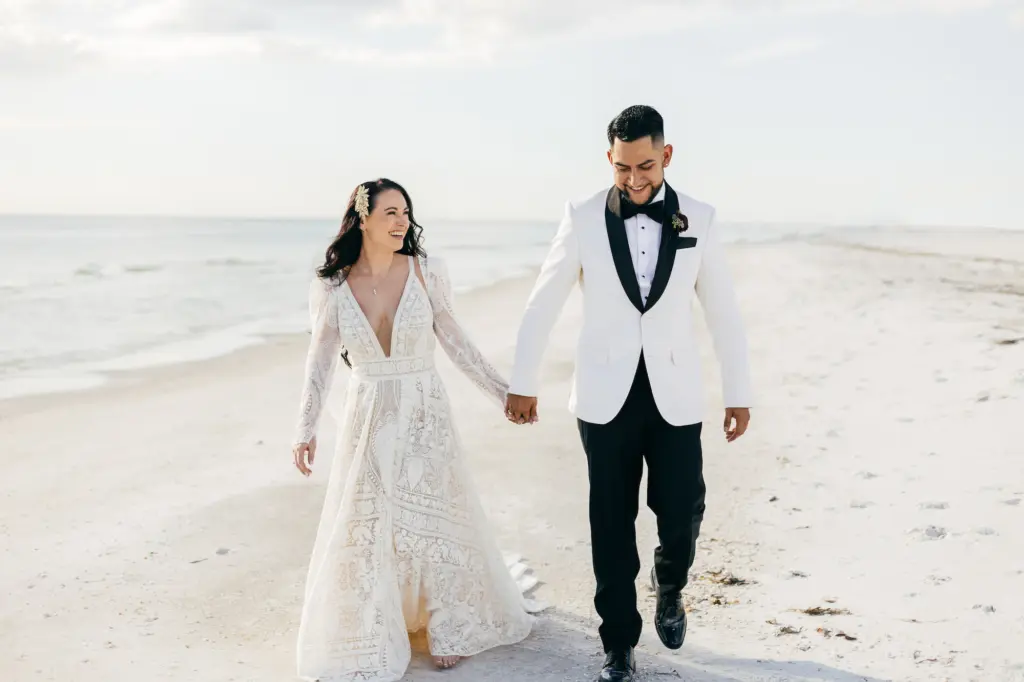 Bride and Groom Walking on the Longboat Key Club Resort Beach Wedding Portrait