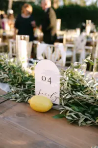 Classic White Arch Table Number Sign with Lemon and Greenery Garland Italian Wedding Reception Centerpiece Decor Inspiration