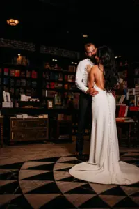 Romantic Open Back Second Wedding Reception Dress Ideas | Moody Bride and Groom Wedding Portrait | Tampa Bay Photographer Videographer Sabrina Autumn Photography | Downtown Event Venue Oxford Exchange Bookstore