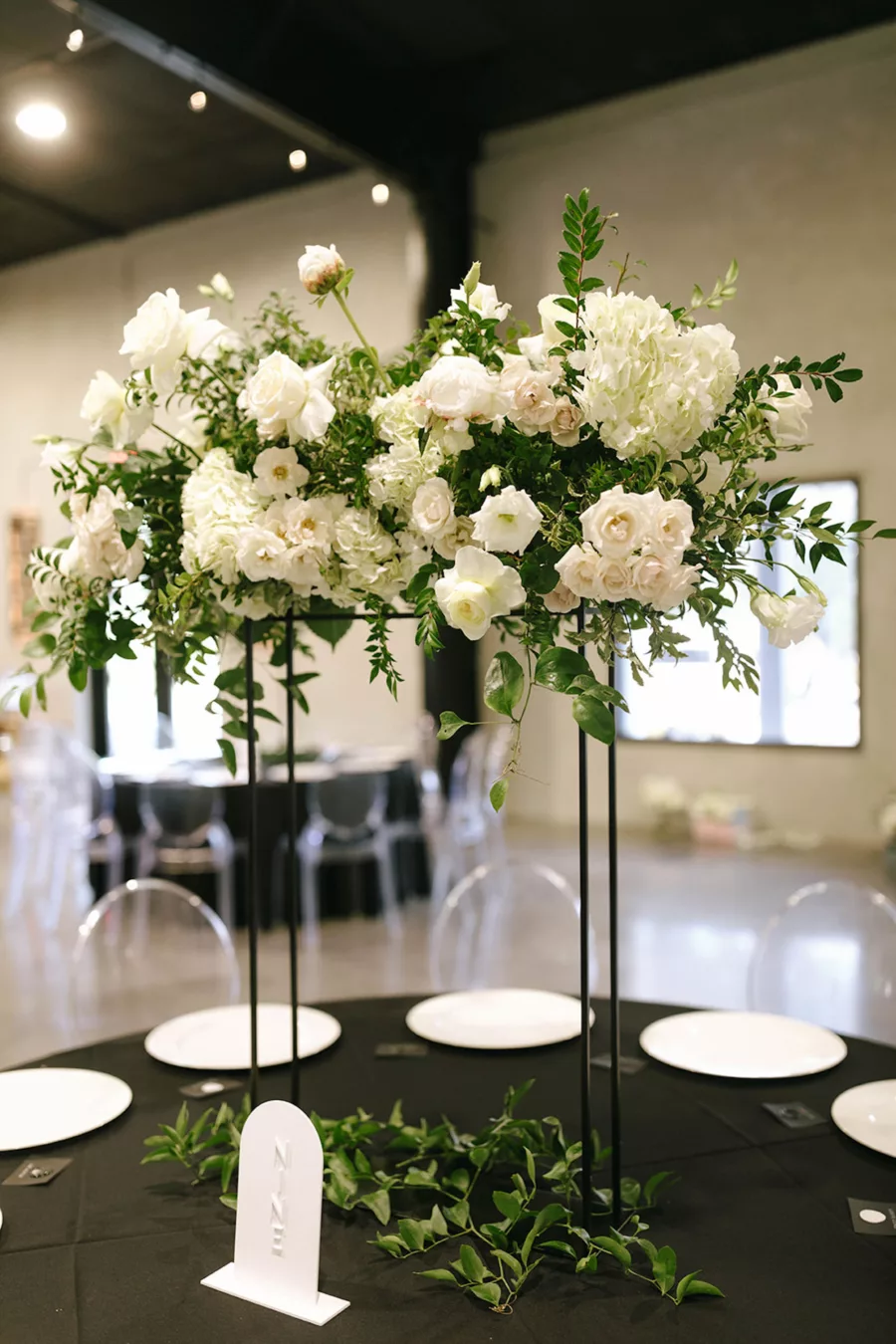 Tall Black Flower Stand with White Roses, Hydrangeas, and Greenery Centerpiece Decor Ideas | Tampa Bay Florist Bloom Shakalaka