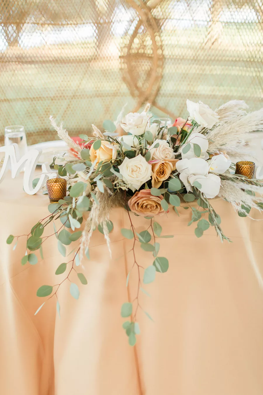 Boho Wedding Reception Sweetheart Table Flower Arrangement Ideas | White and Orange Roses, Pampas Grass, and Eucalyptus