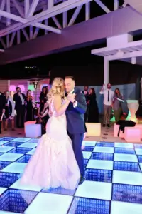 Bride and Groom Last Dance Rooftop Terrace Wedding Reception | LED Dance Floor Inspiration | Tampa Bay Event Venue The Florida Aquarium | Event Planner Breezin' Weddings