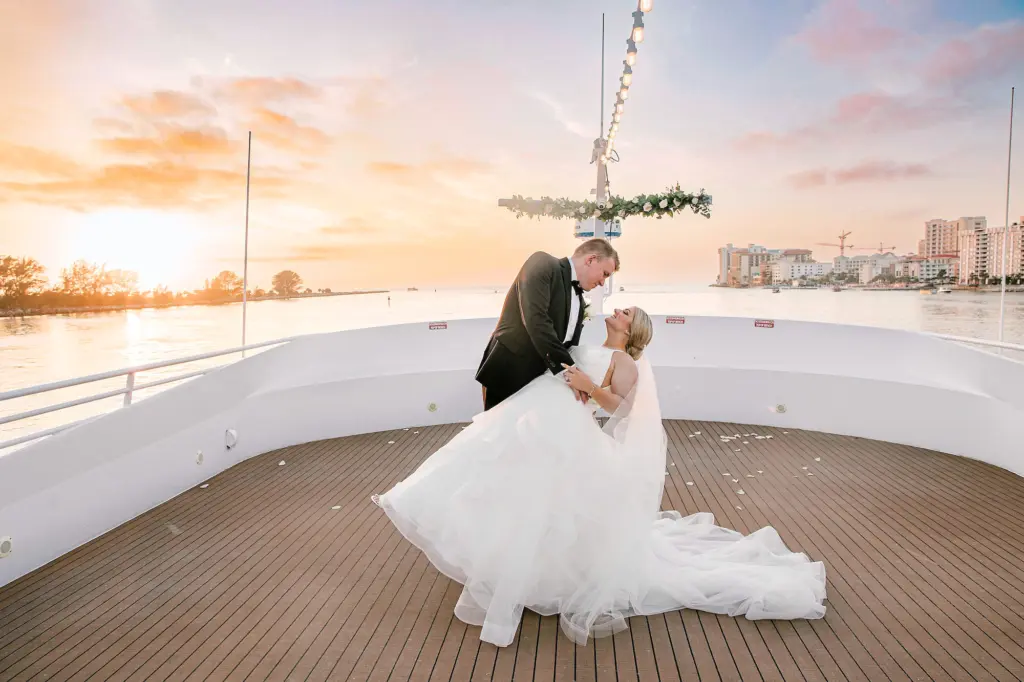 Bride and Groom On Bow of Ship Sunset Wedding Portrait | Tampa Bay Event Venue Yacht StarShip