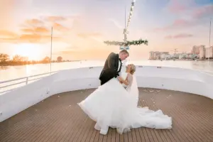 Bride and Groom On Bow of Ship Sunset Wedding Portrait | Tampa Bay Event Venue Yacht StarShip