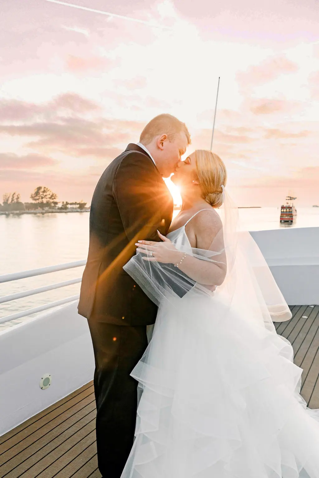 Bride and Groom Sunset Wedding Portrait | Elegant White Tiered Tulle A-Line Sophia Tolli Wedding Dress Inspiration | Tampa Bay Event Venue Yacht StarShip