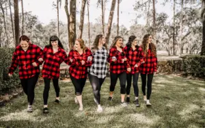 Matching Red, White, and Black Buffalo Plaid Checkered Flannel Shirts | Bride and Bridesmaids Getting Ready inspiration
