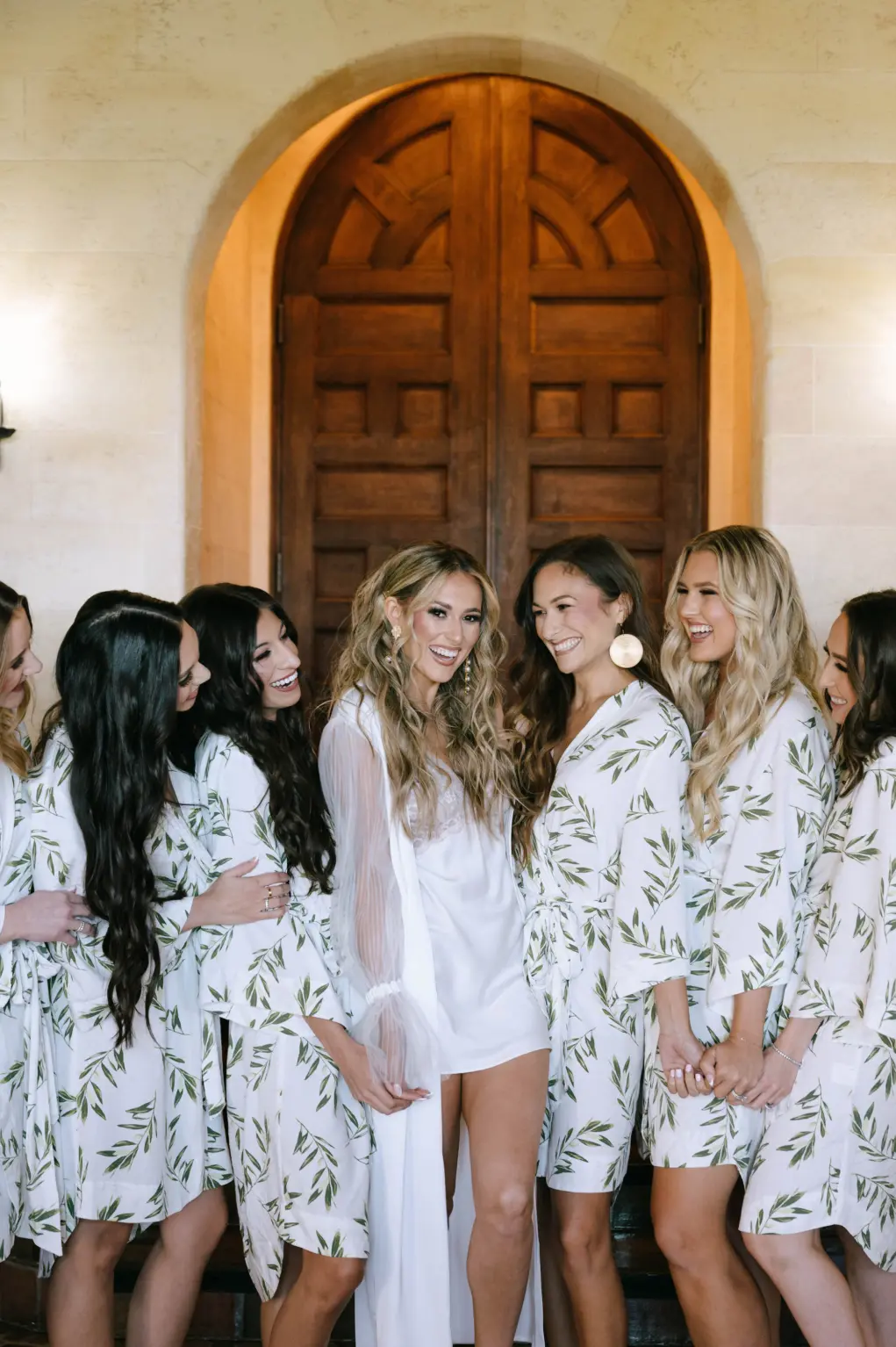 Long Wavy Bridal Hair and Elegant Makeup Ideas | Matching Botanical Leaf Print Wedding Day Getting Ready Robes Bridesmaid Gift Inspiration