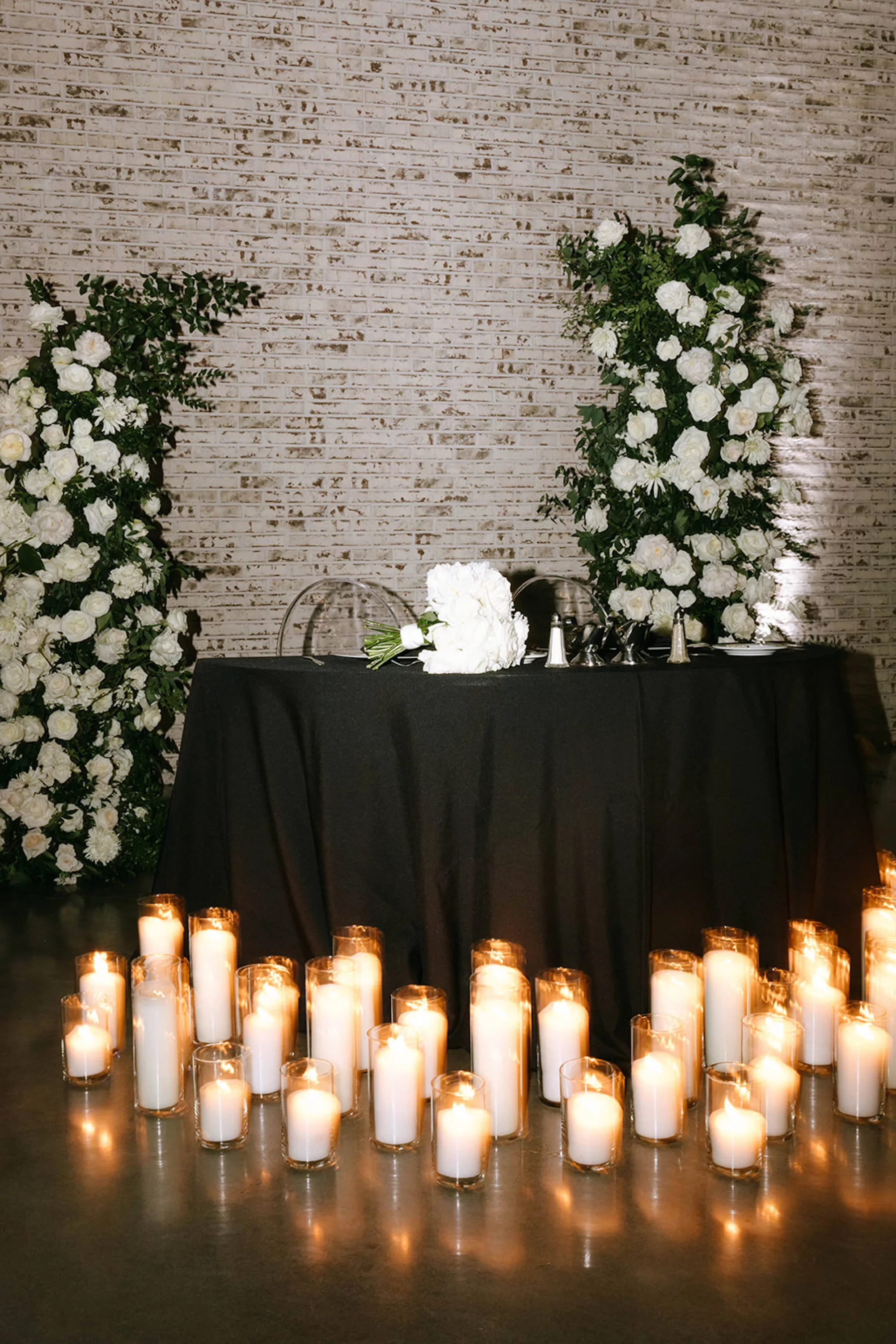 Moody Modern Black and White Wedding Reception Sweetheart Table Candlelight Decor Ideas