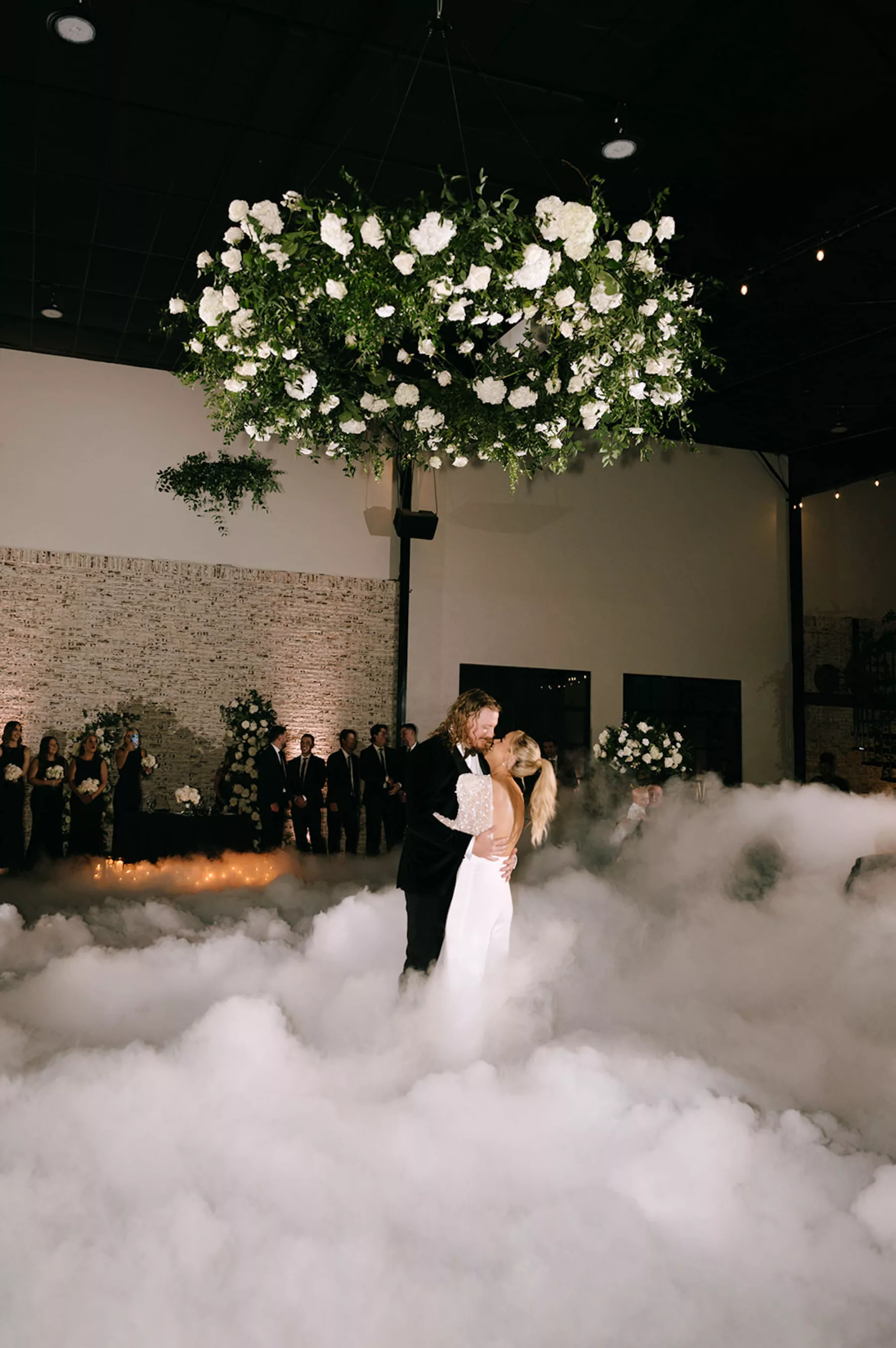 Bride and Groom First Dance with Fog Machine Dancing on a Cloud Inspiration | White Rose, Hydrangeas, and Greenery Floral Chandelier Ideas | Tampa Bay Florist Bloom Shakalaka | DJ Graingertainment