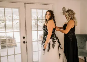 Bride Getting Ready Wedding Portrait | Black Mother of the Bride Dress Inspiration | Natural Curly Wedding Hair and Makeup Ideas | Elegant Strapless Black Lace, White Tulle, A-Line Gothic David's Bridal Wedding Dress Ideas