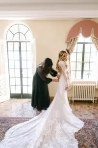 Bride Getting Ready | Sheer White Long-Sleeve Lace Mermaid Martina Liana Giselle Wedding Dress with Cathedral Train Inspiration