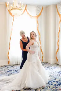 Bride and Mother Getting Ready | White and Nude Deep V Neckline Lace and Tulle Mermaid Wedding Dress with Cathedral Length Train Ideas