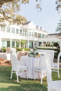 White Southern Outdoor Black-Tie Wedding Reception Decor Inspiration | White Roses, Hydrangeas, and Greenery, Gold Votives Centerpiece Ideas | White King Louis Dining Chairs | Tampa Bay Florist Botanica Design Studio | South Tampa Venue Palma Ceia Golf and Country Club