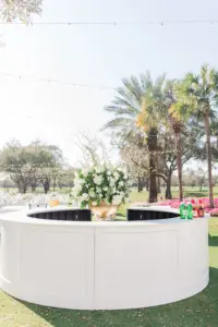 White Round Circular Bar for Wedding Reception Inspiration | Large Floral Arrangement with White Roses, Hydrangeas, and Greenery Ideas | Tampa Bay Florist Botanica Design Studio