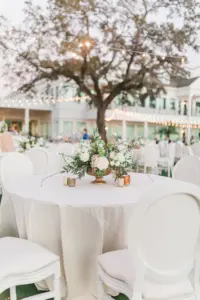 White Southern Outdoor Black-Tie Wedding Reception Decor Inspiration | White Roses, Hydrangeas, and Greenery Centerpiece Ideas | White King Louis Dining Chairs | Tampa Bay Florist Botanica Design Studio | South Tampa Event Venue Palma Ceia Golf and Country Club