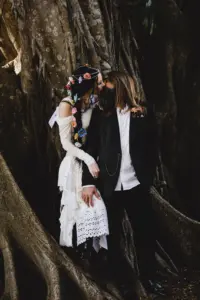 Romantic Bride and Groom Under Large Live Oak Tree Wedding Portrait | Boho Flower Hair Braid Inspiration