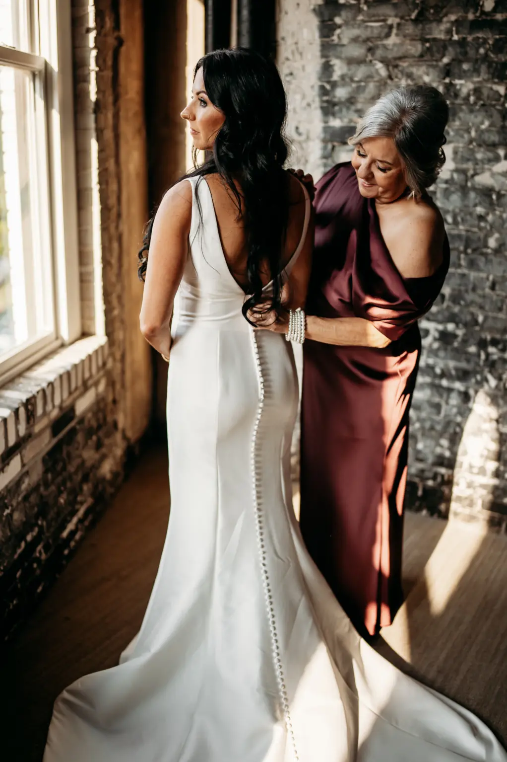 Bride and Mother Getting Ready | Classic Ivory Open Back Satin Button Down Wedding Dress Ideas | Bridal Hair and Makeup Inspiration | Tampa Bay Femme Akoi Beauty Studio | Photographer Videographer Sabrina Autumn Photography