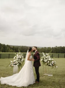 Bride and Groom First Kiss Wedding Portrait | Outdoor Florida Wedding Ceremony Decor Ideas | Brooksville Event Venue La Hacienda on Snow Hill | Florida Planner The Olive Tree Weddings