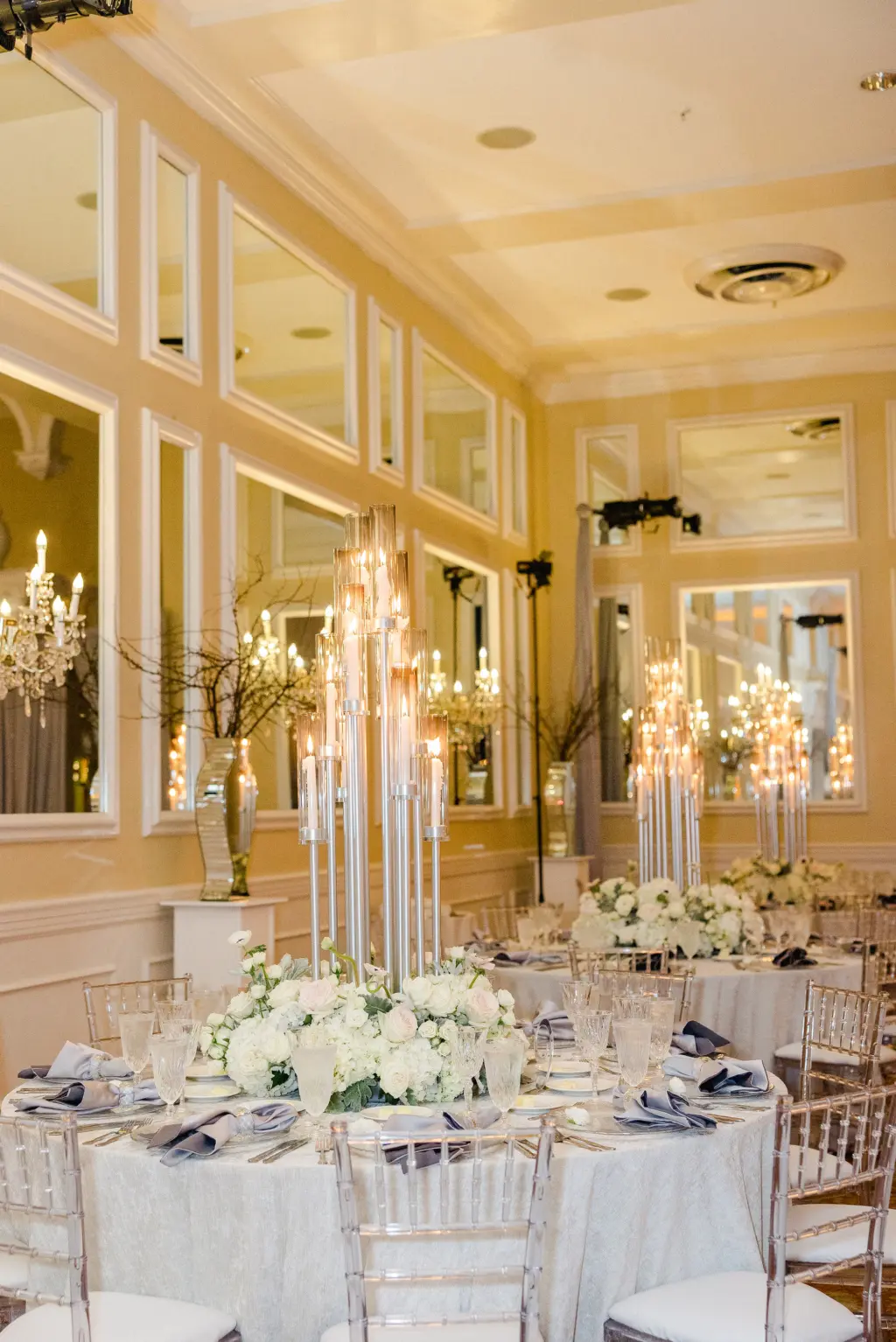 Tall Silver Candelabra Wedding Reception Centerpiece Decor Inspiration with White Monochromatic Anemone, Roses, and Hydrangeas Flower Arrangement Ideas
