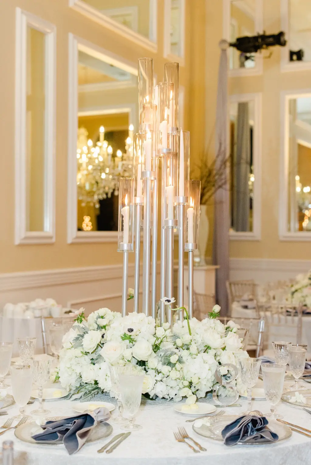 Tall Silver Candelabra Wedding Reception Centerpiece Decor Inspiration with White Monochromatic Anemone, Roses, and Hydrangeas Flower Arrangement Ideas