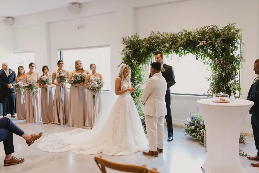 Whimsical Indoor Fern and Greenery Wedding Ceremony Arch Decor Ideas | Bride and Groom Unity Communion | Neutral Beige Bridesmaids Dress Inspiration | Tampa Bay Event Venue Simpson Lakes