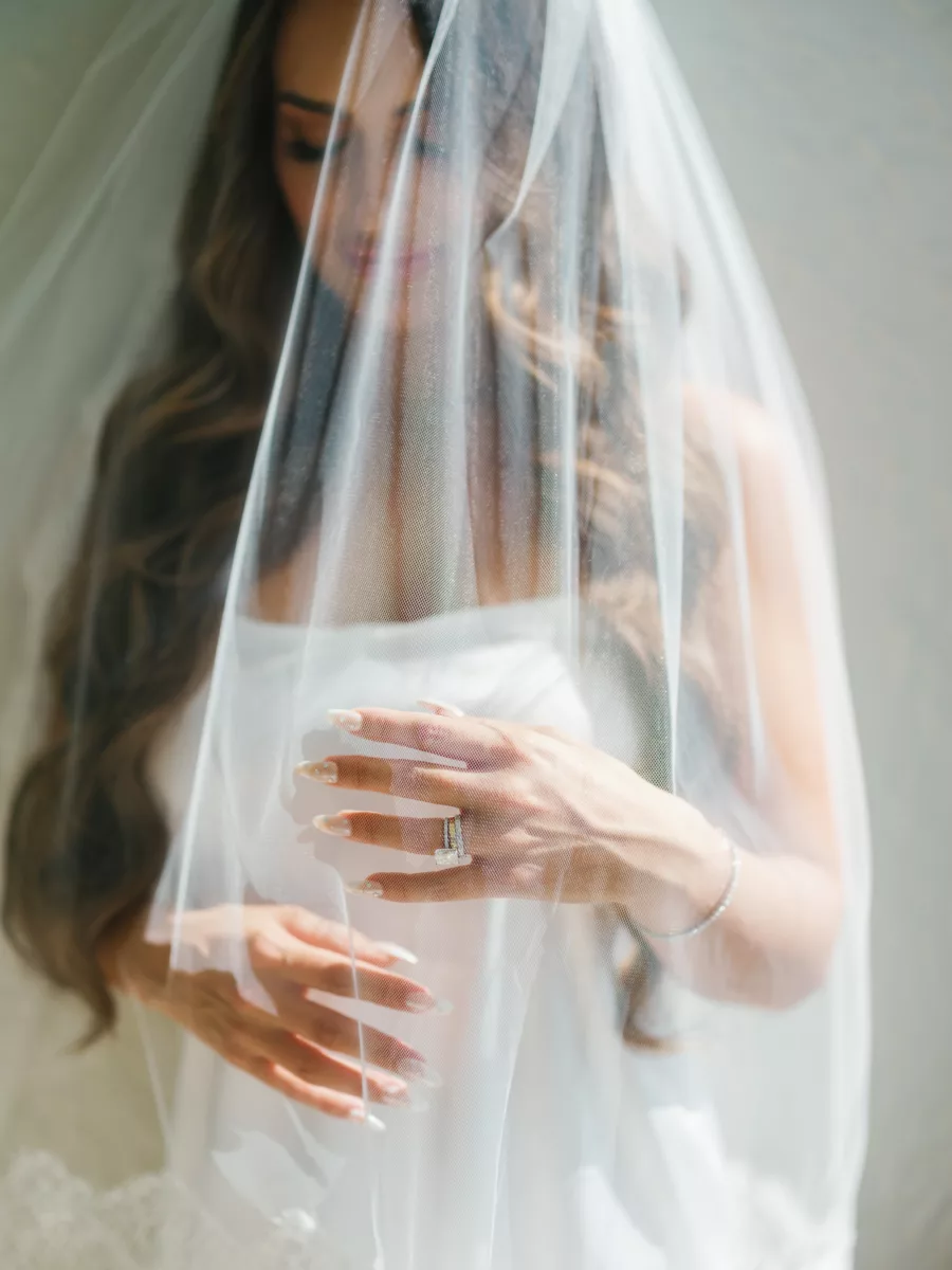 Bride Getting Ready in Elegant Ivory Satin Off The Shoulder Ballgown Wedding Dress Inspiration | Chapel Length Veil | Bridal Hair and Makeup Ideas