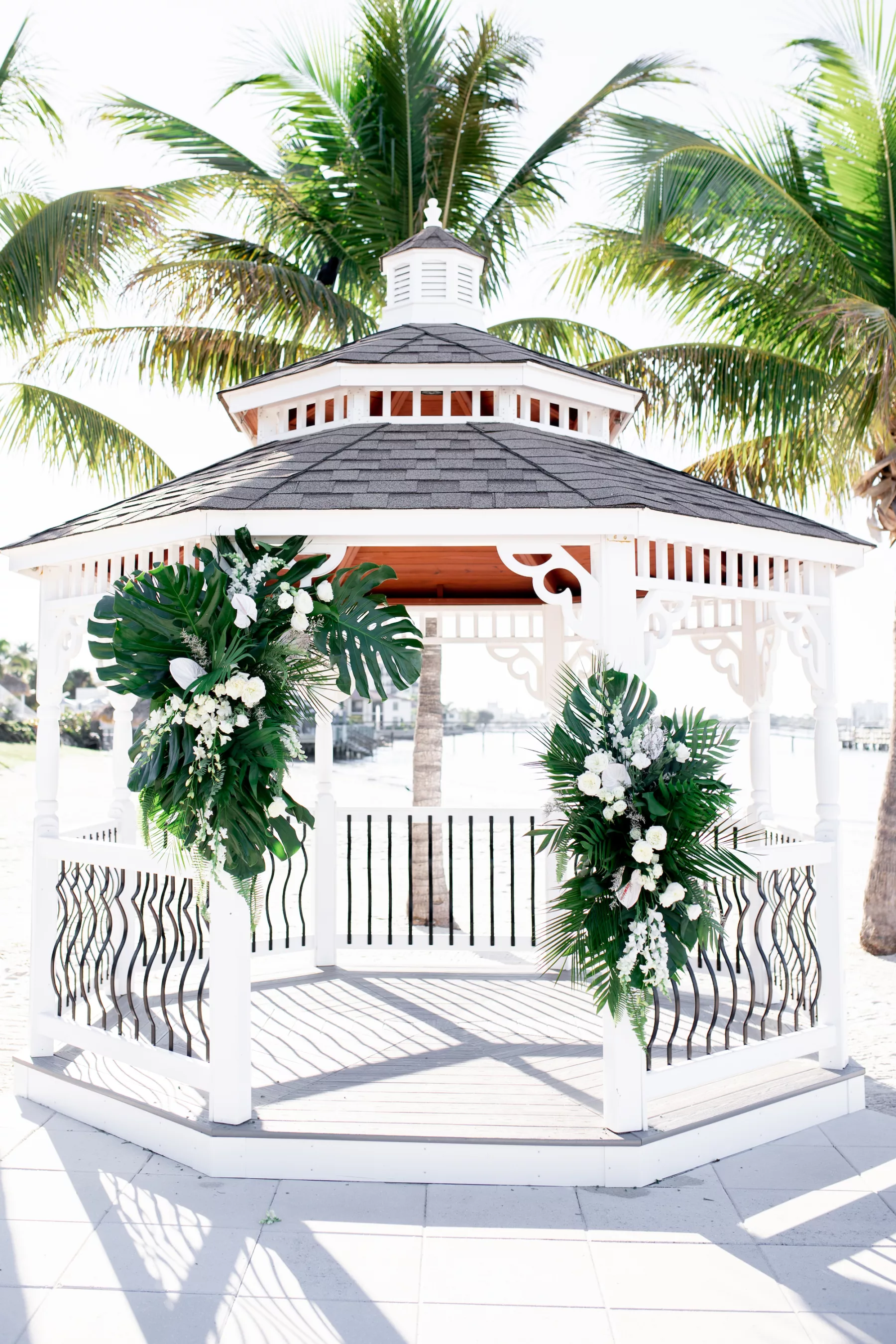Tropical Wedding Ceremony Inspiration | Monstera, Palm Leaf, and White Roses Gazebo Decor Ideas | St Pete Event Venue Isla Del Sol Yacht and Country Club