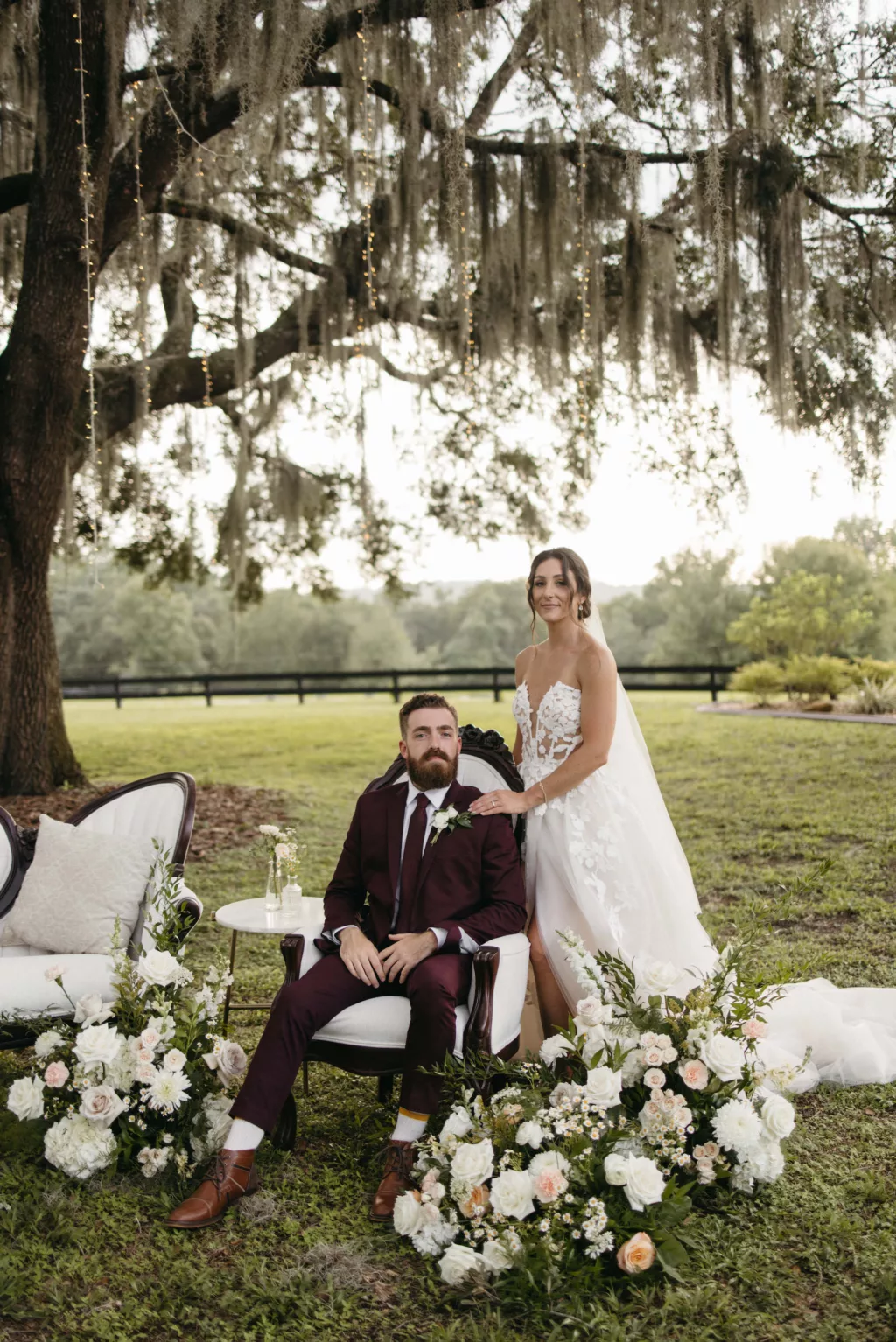 Bride and Groom Just Married Wedding Portrait | Wedding Reception Flower Arrangement Decor Inspiration | Pink Roses, White Hydrangeas, Feverfew Daisies, Stock Flowers, Carnations, and Greenery | Tampa Planner The Olive Tree Weddings | Venue La Hacienda on Snow Hill
