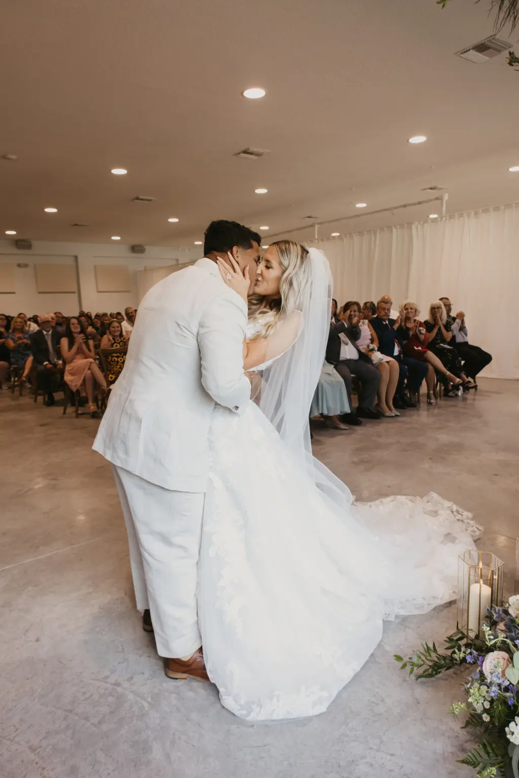 Bride and Groom First Kiss Wedding Portrait | Indoor Pastel Wedding Ceremony Inspiration