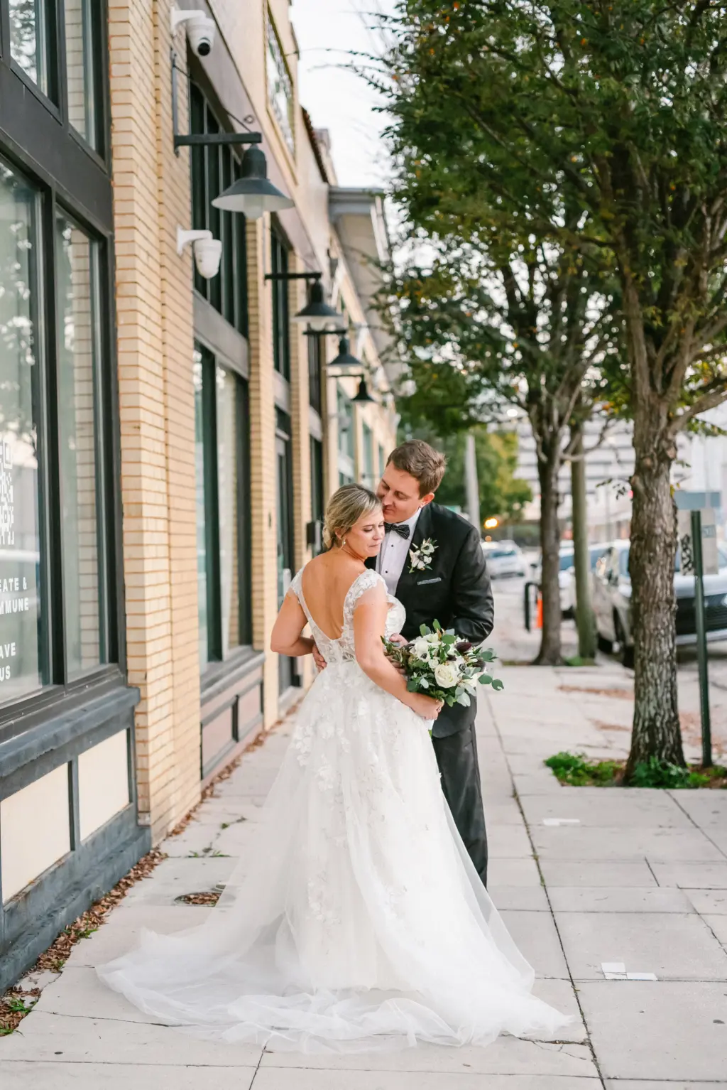 Bride and Groom Just Married Outdoor Wedding Portrait | Ivory Tulle and Lace Deep V Neckline A-Line Sheer Cap Sleeve Wedding Dress Ideas | Tampa Bay Hair and Makeup Artist Femme Akoi Beauty Studio