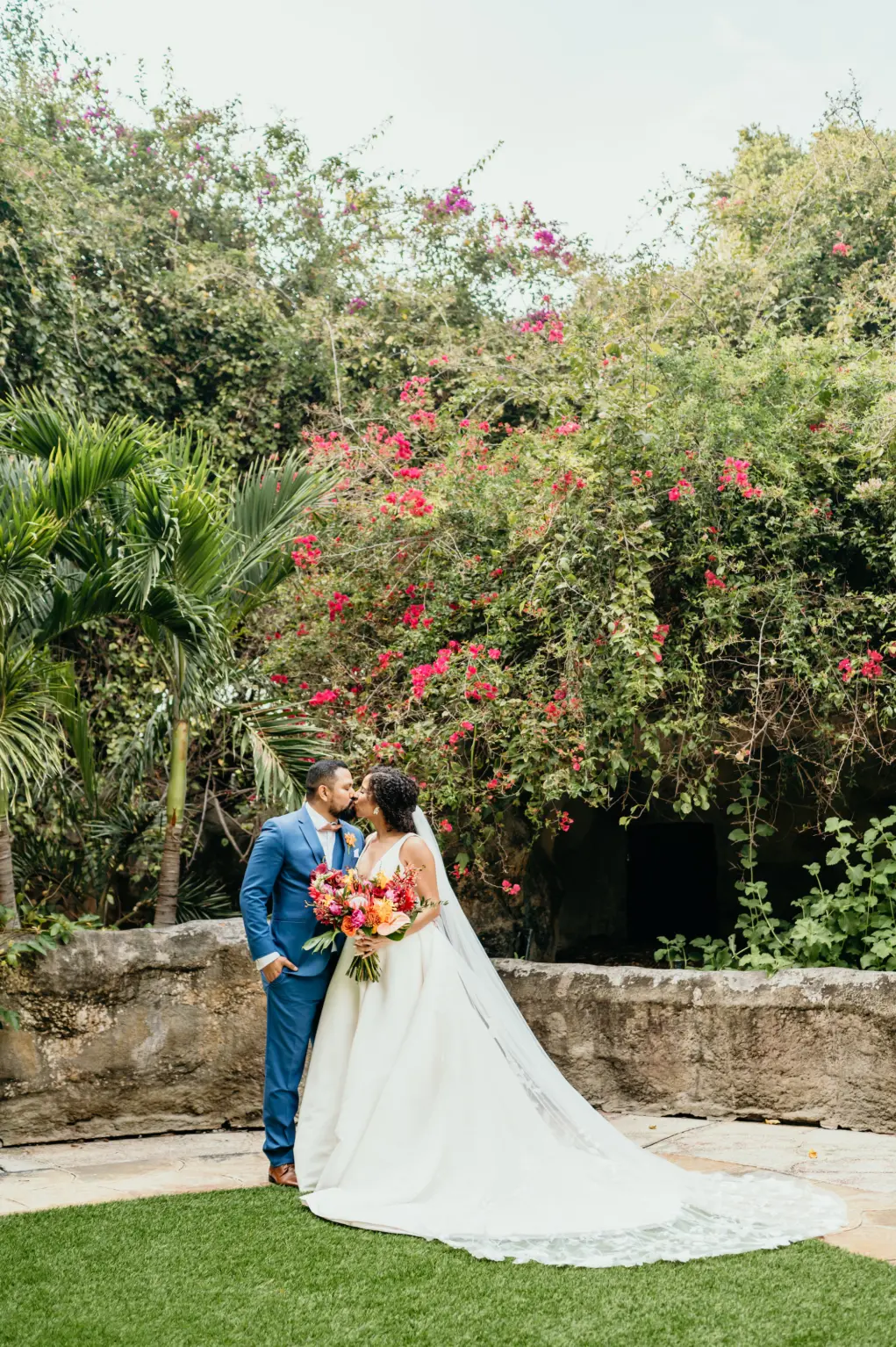 Bride and Groom Just Married Wedding Portrait | Tropical Bridal Bouquet with Red King Protea, Orange Pincushion Protea, Pink Roses, Orchids, and Palm Leaves | St Pete Florist Save The Date Florida | Tampa Bay Event Planner EventFull Weddings | Outdoor Venue Sunken Gardens