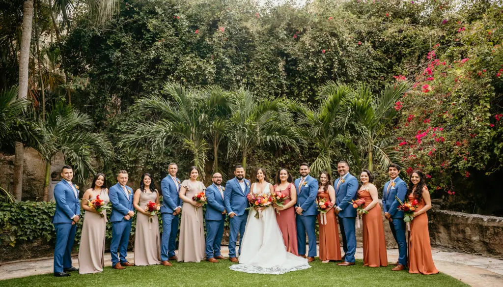 Mismatched Neutral Beige Taupe and Copper Burnt Orange Bridesmaids Dress Ideas | Dusty Blue Groomsmen Suit Inspiration | Tropical Wedding Party Boutonnieres and Bouquets | Tampa Bay Florist Save The Date Florida | St Pete Planner Eventfull Weddings | Downtown St. Petersburg Event Venue Sunken Gardens