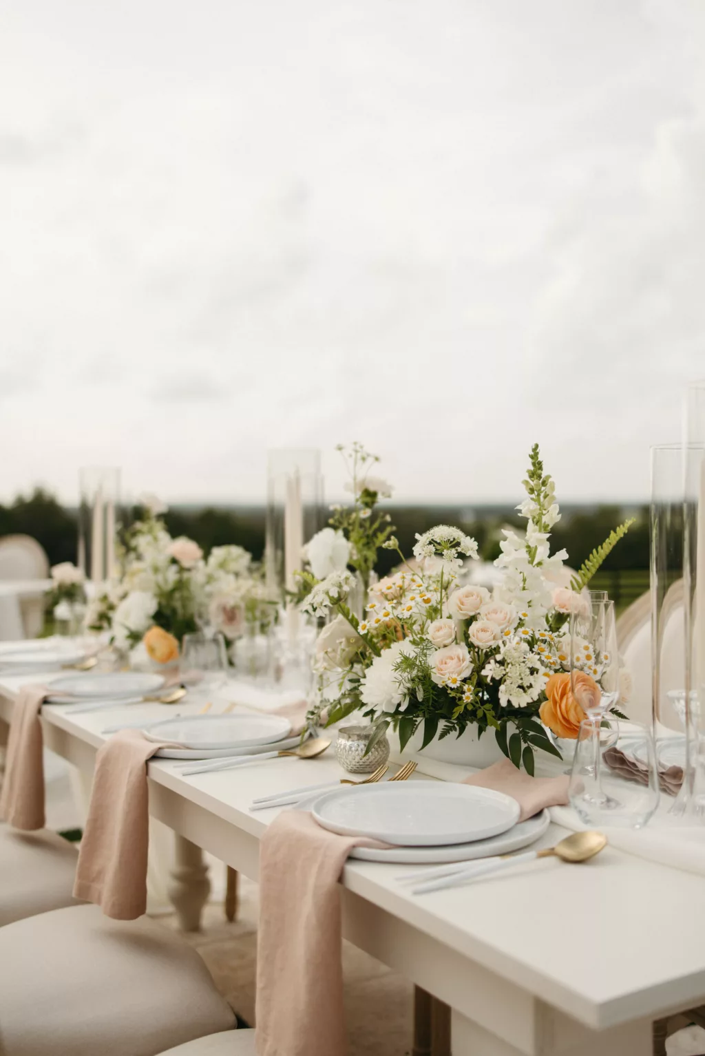 Neutral Spring European Inspired Wedding Reception Tablescape Ideas | Gold and White Flatware Inspiration | Blush Linen Napkins | Taper Candles, White Roses and Feverfew Daisy Centerpiece Decor | Tampa Bay Event Planner The Olive Tree Weddings