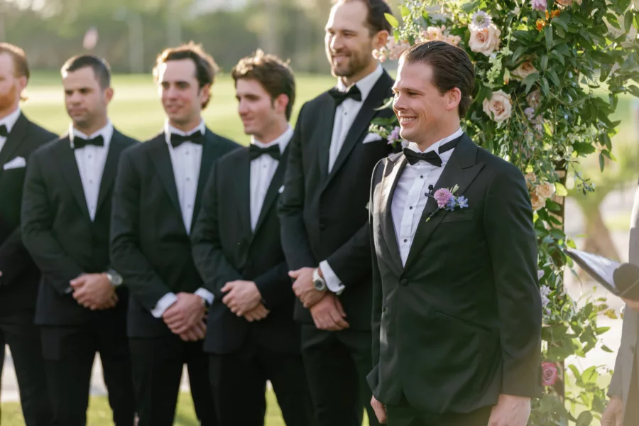 Groom's Reaction to Bride Walking Down Wedding Aisle | Black Tuxedo and Bowtie Attire Ideas
