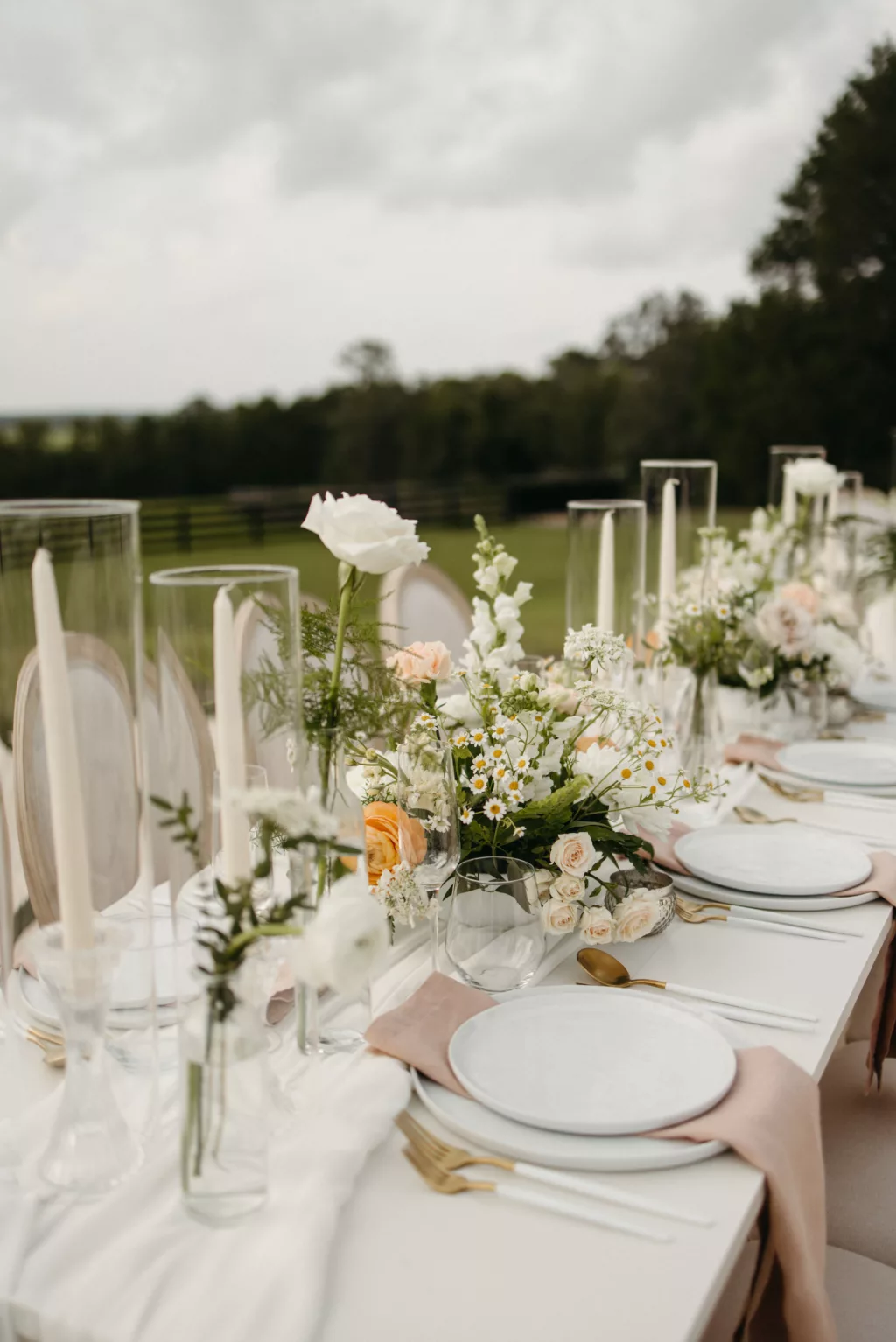 Neutral Spring European Inspired Wedding Reception Tablescape Ideas | Gold and White Flatware Inspiration | Taper Candles, White Roses and Feverfew Daisy Centerpiece Decor | Tampa Bay Event Planner The Olive Tree Weddings