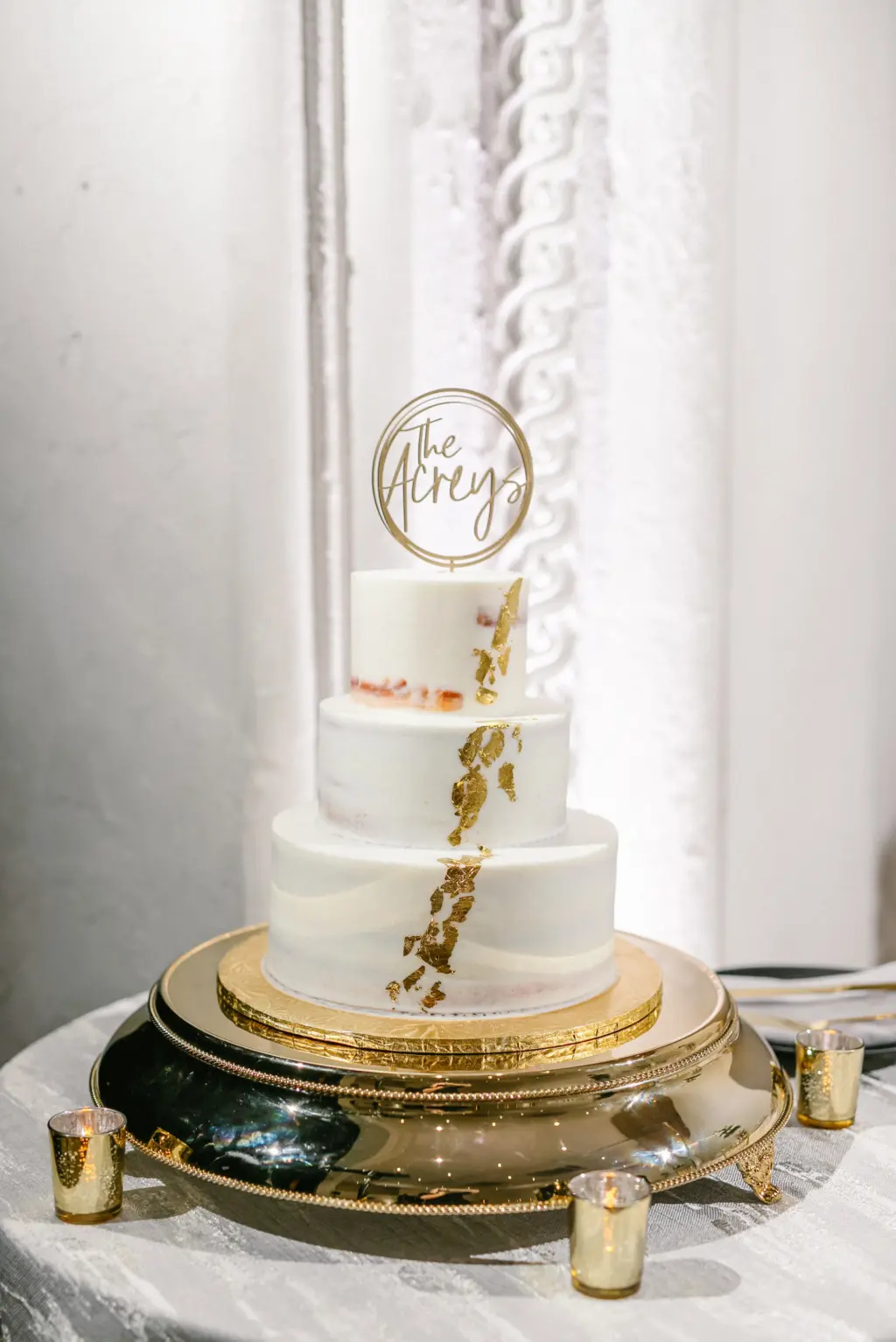 White Three-tiered Round Semi-Naked Wedding Cake with Edible Gold Leaf Foil Accents Inspiration | Custom Laser Cut Wedding Cake Topper Ideas