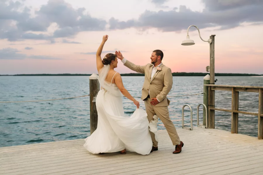 Bride and Groom Dancing on the Dock Wedding Portrait | Venue Venue Tampa Bay Watch | Photographer Amber McWhorter Photography