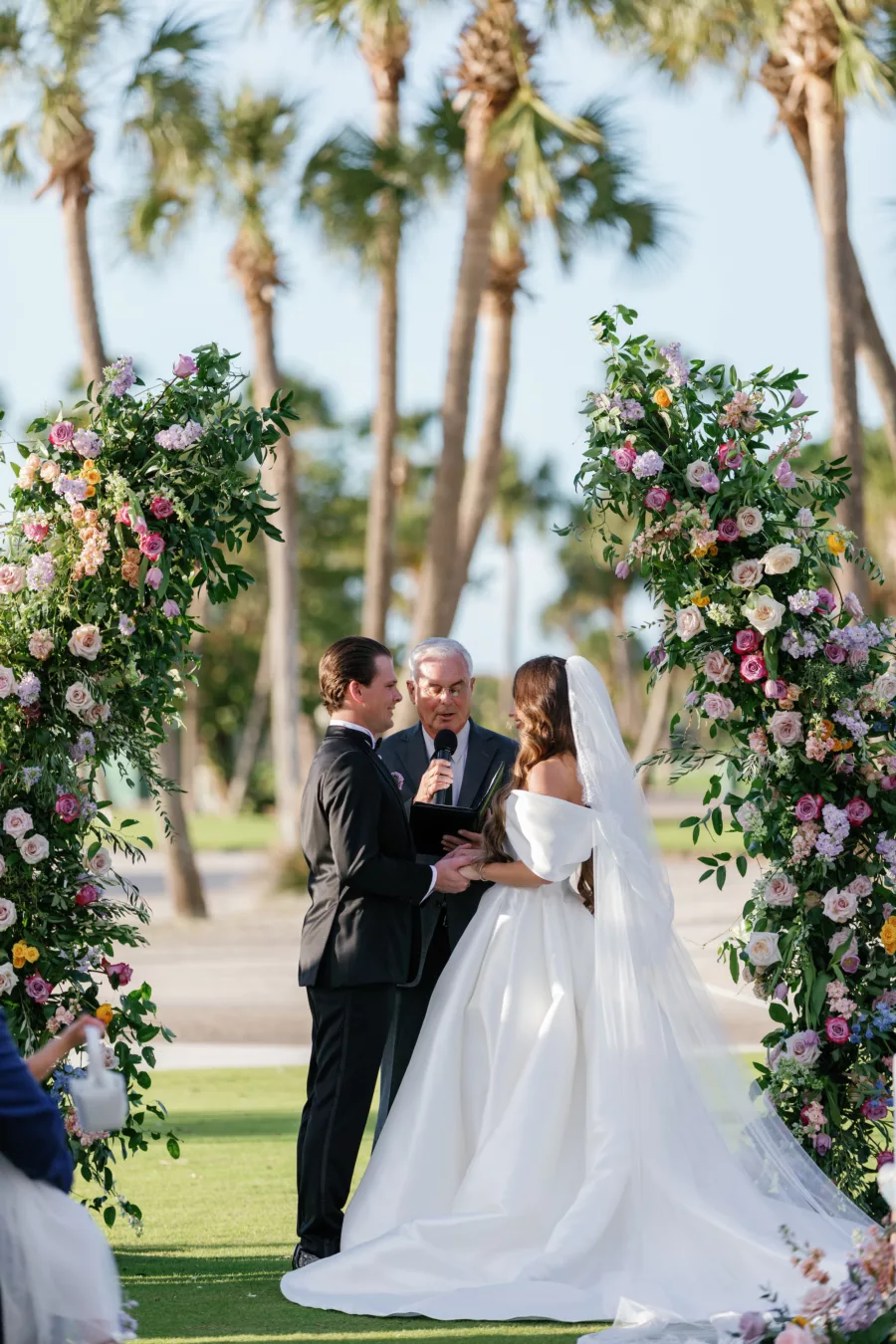 Bride and Groom Vow Exchange | Whimsical Pastel Wildflower Wedding Ceremony Arch Decor Inspiration