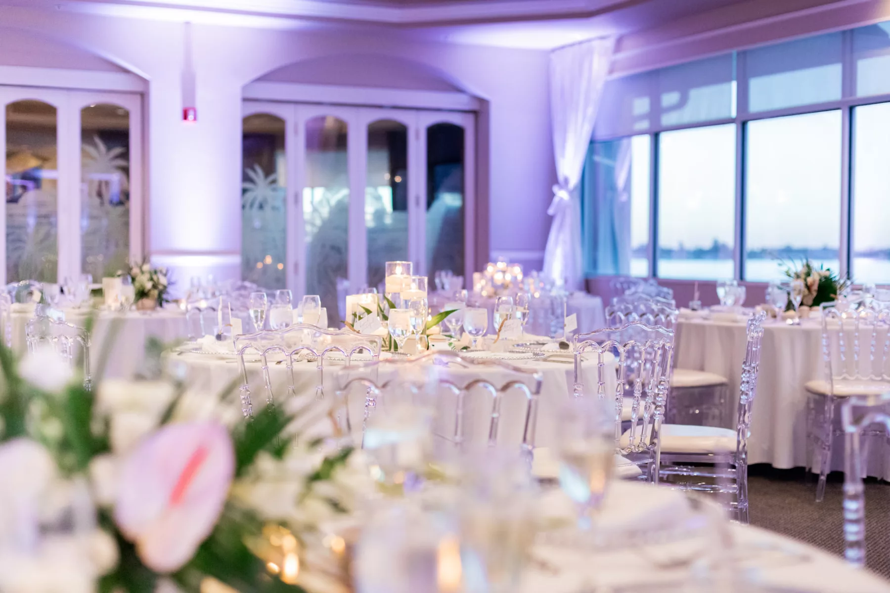 Modern White Tropical Wedding Reception with Acrylic Ghost Banquet Chairs Inspiration | Tampa Bay Event Venue Isla Del Sol Yacht and Country Club