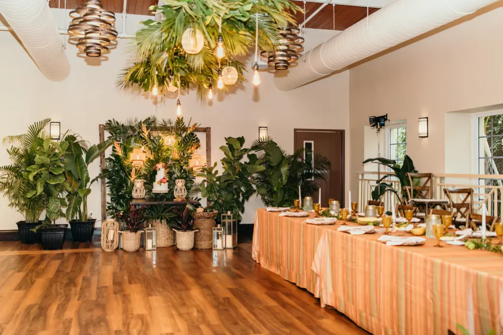 Tropical Wedding Reception Long Feasting Table Inspiration | Taper Candle and Greenery Garland Centerpiece Decor | Boho Round White Three-Tiered Buttercream Wedding Cake Table with Pink and Orange Roses, Protea Flowers | Suspended Palm Leaf Chandelier | Bakery Tampa Bay Cake Company | St Pete Florist Save The Date Florida | Kate Ryan Event Rentals | Tampa Bay Planner Eventfull Weddings