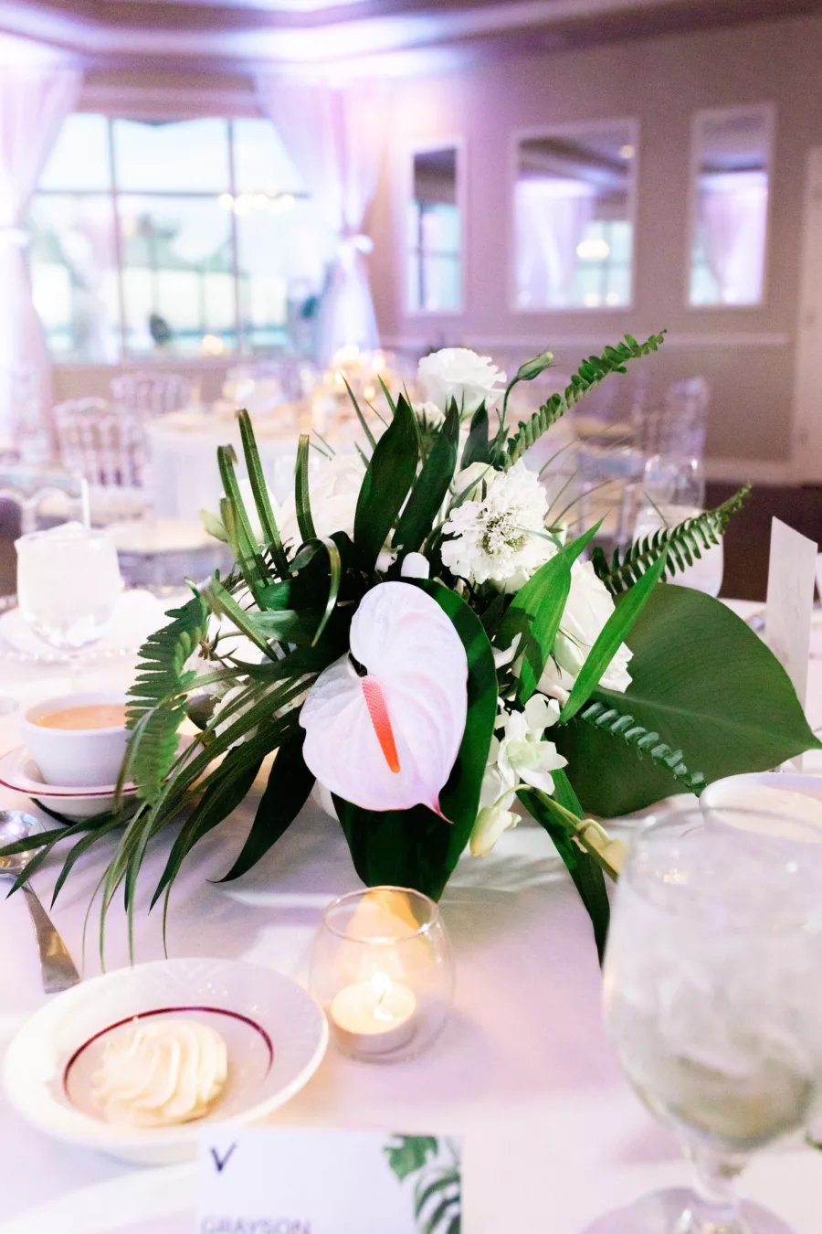 Tropical White Anthurium, Ferns, Palm Leaves and Greenery Wedding Reception Centerpiece Decor Inspiration