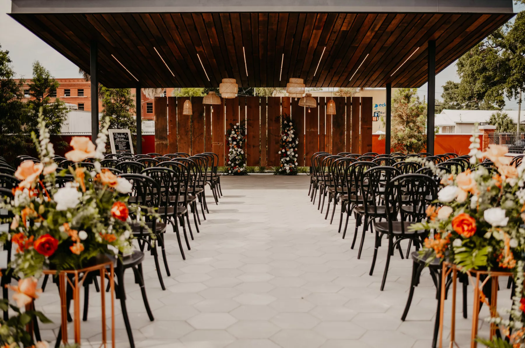 Outdoor Boho Industrial Terracotta and Black Wedding Ceremony Decor Inspiration | Tampa Bay Planner B Eventful | Outdoor Courtyard Venue J.C. Newman Cigar Co.
