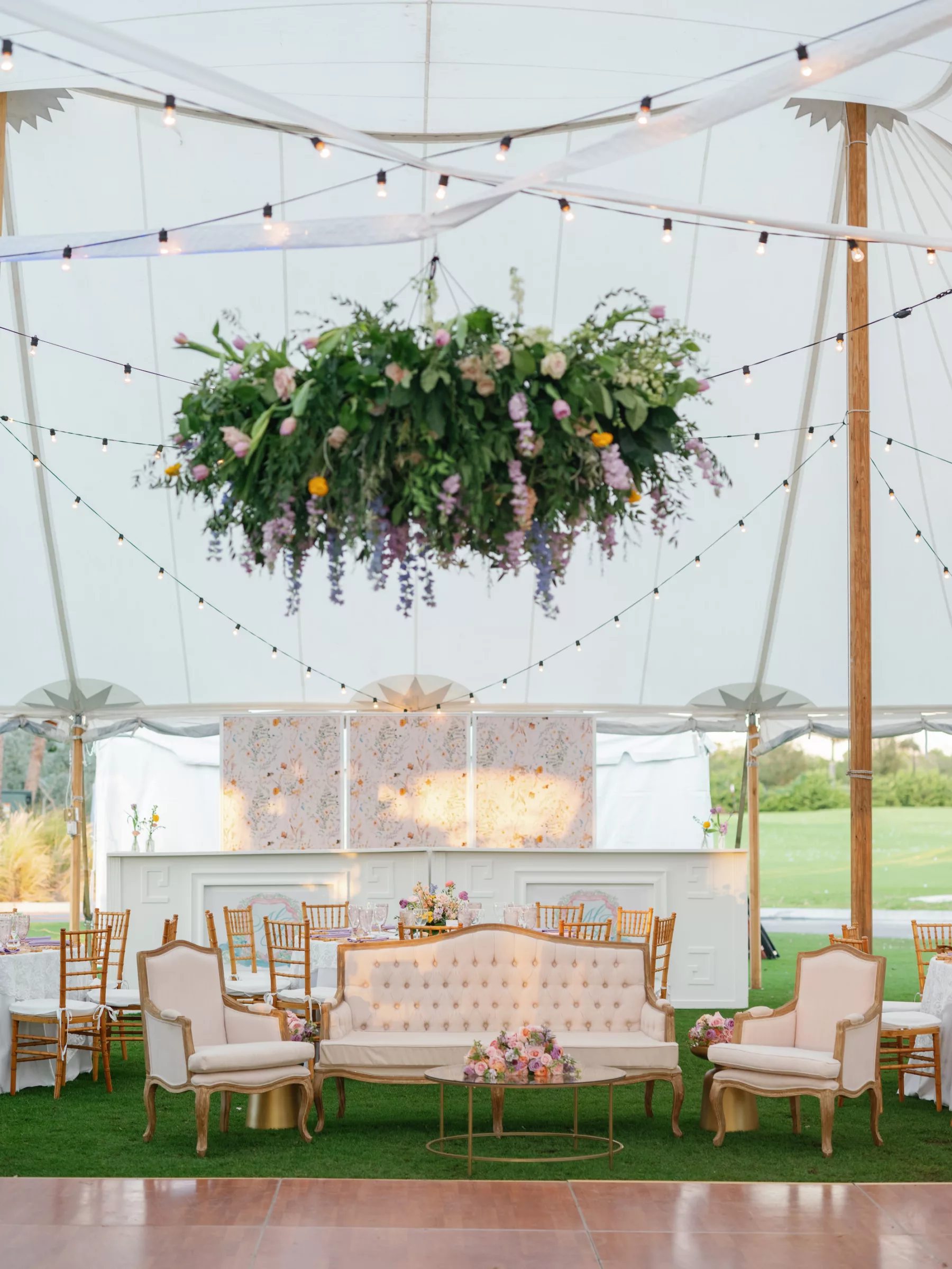 Luxurious Tented Pastel Old Florida Wedding Reception Inspiration with Vintage Lounge Seating Inspiration | Wildflower Chandelier Ideas | Sarasota Wedding Venue The Resort at Longboat Key Club