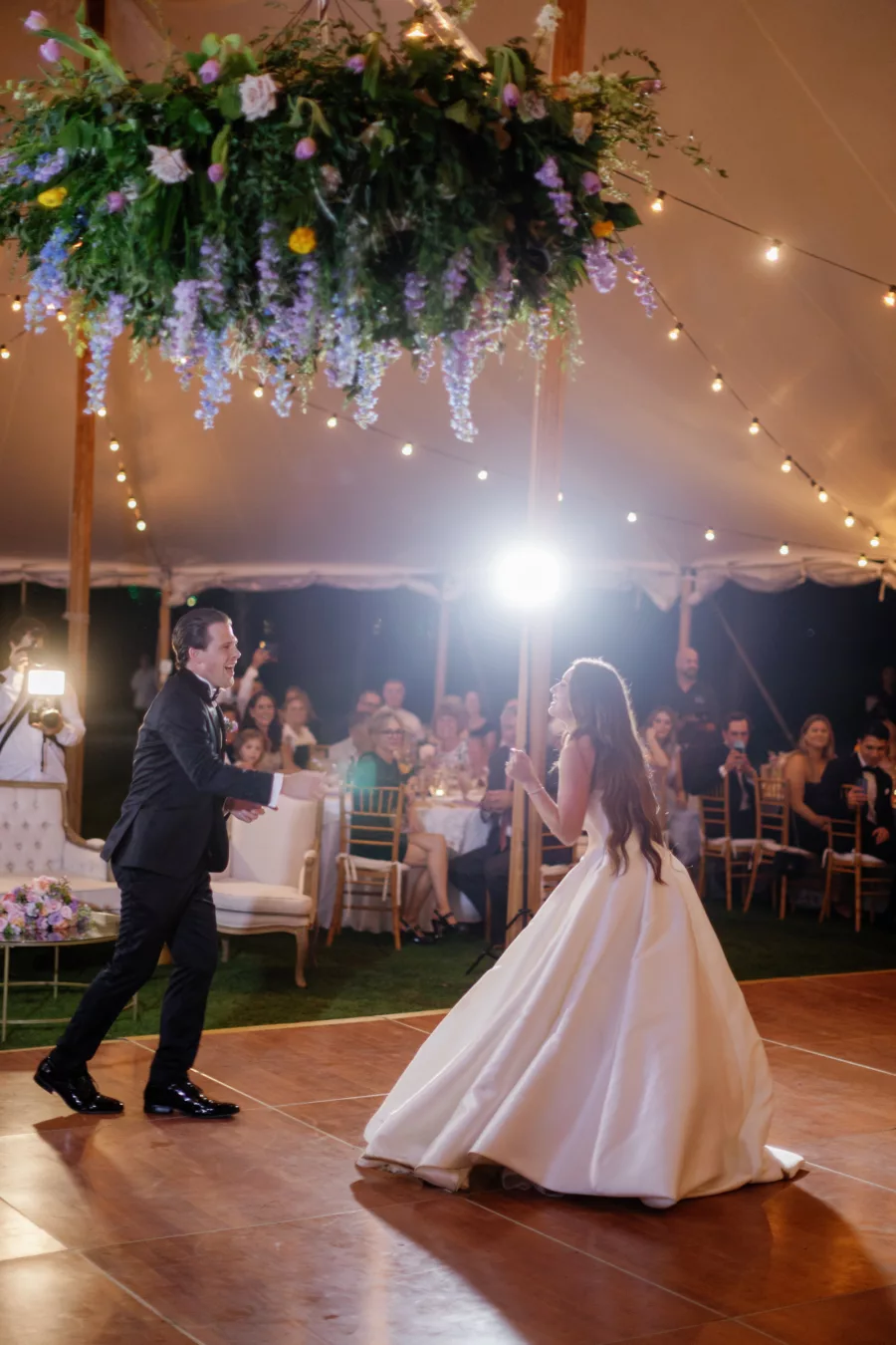 Bride and Groom's Choreographed First Dance Wedding Portrait | Luxurious Tented Old Florida Wedding Reception Ideas | Pastel Wildflower Chandelier Inspiration