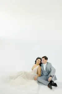 Romantic Bride and Groom Wedding Portrait | White Plunging Deep V Neckline A-Line Tulle and Sequin Eisen Stein Wedding Dress Ideas