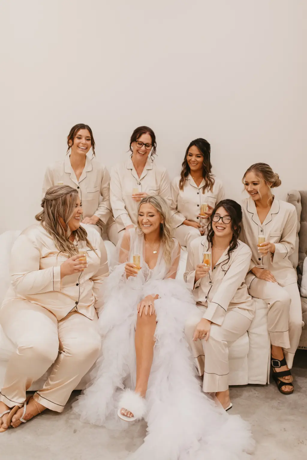 Bride and Bridesmaids Getting Ready on Wedding | Matching Cream Pajamas Inspiration