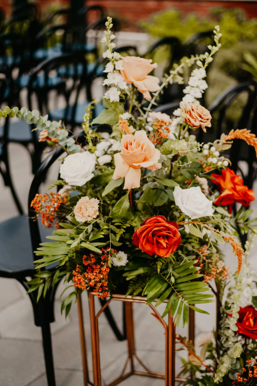 Terracotta, White, and Orange Roses, Greenery, Carnations, Snapdragon, and Greenery Boho Wedding Ceremony Aisle Decor Ideas